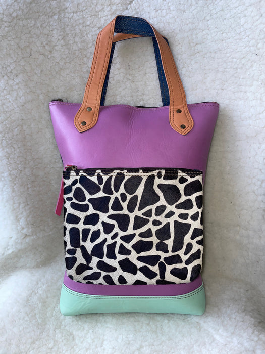Handcrafted, Recycled Leather & Hide Backpack with Detachable Clutch.