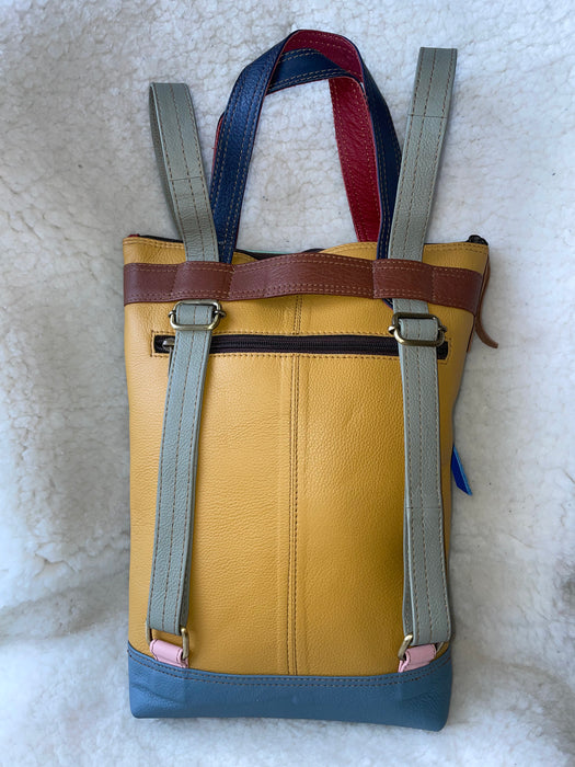 Handcrafted, Recycled Leather & Hide Backpack with Detachable Clutch.