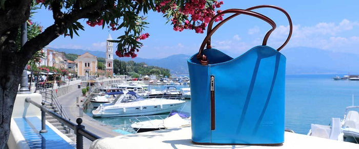 <img src="bag.png" alt="Blue Italian leather handbag">
